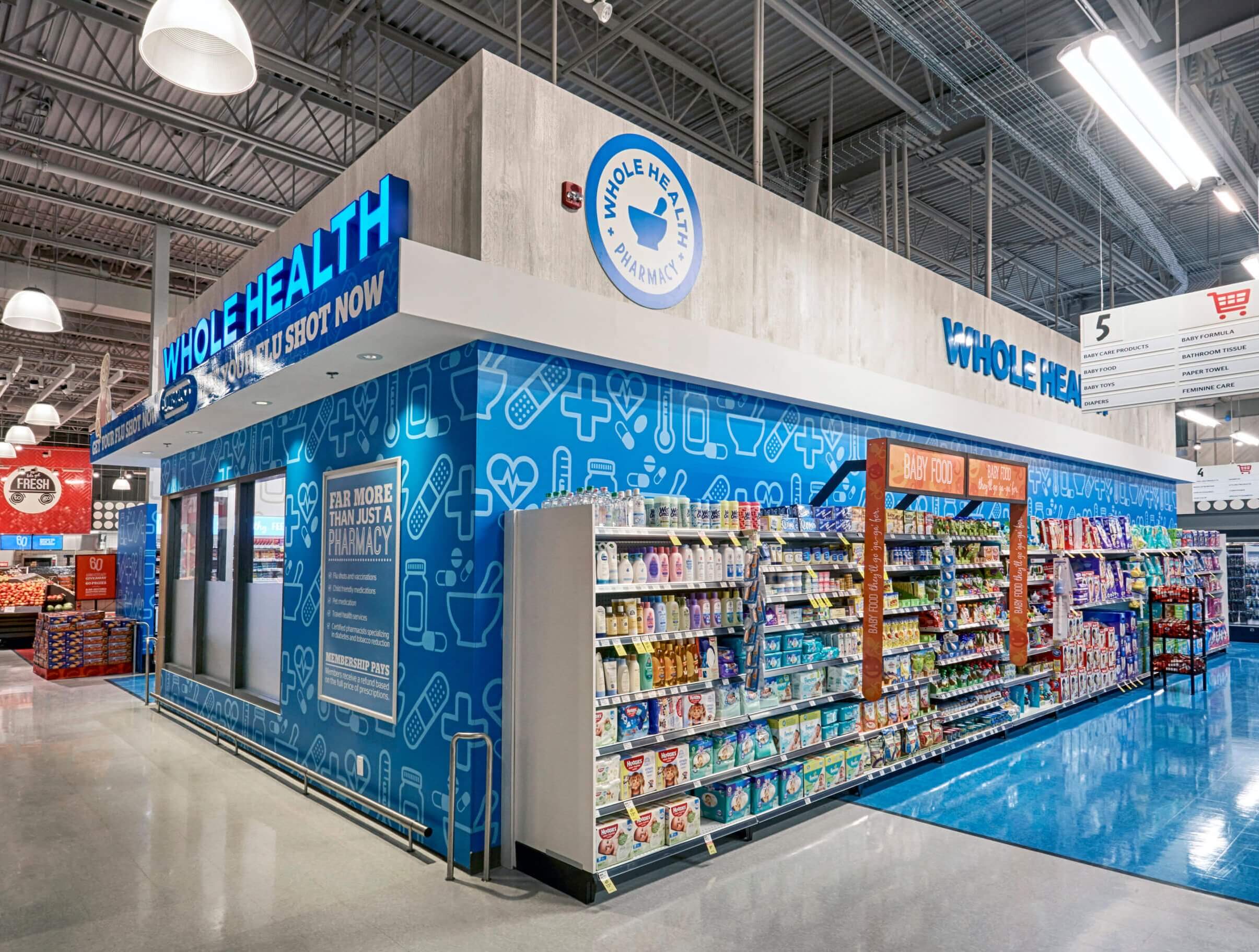 A well-lit storefront with a blue and white color scheme, featuring a large sign that reads