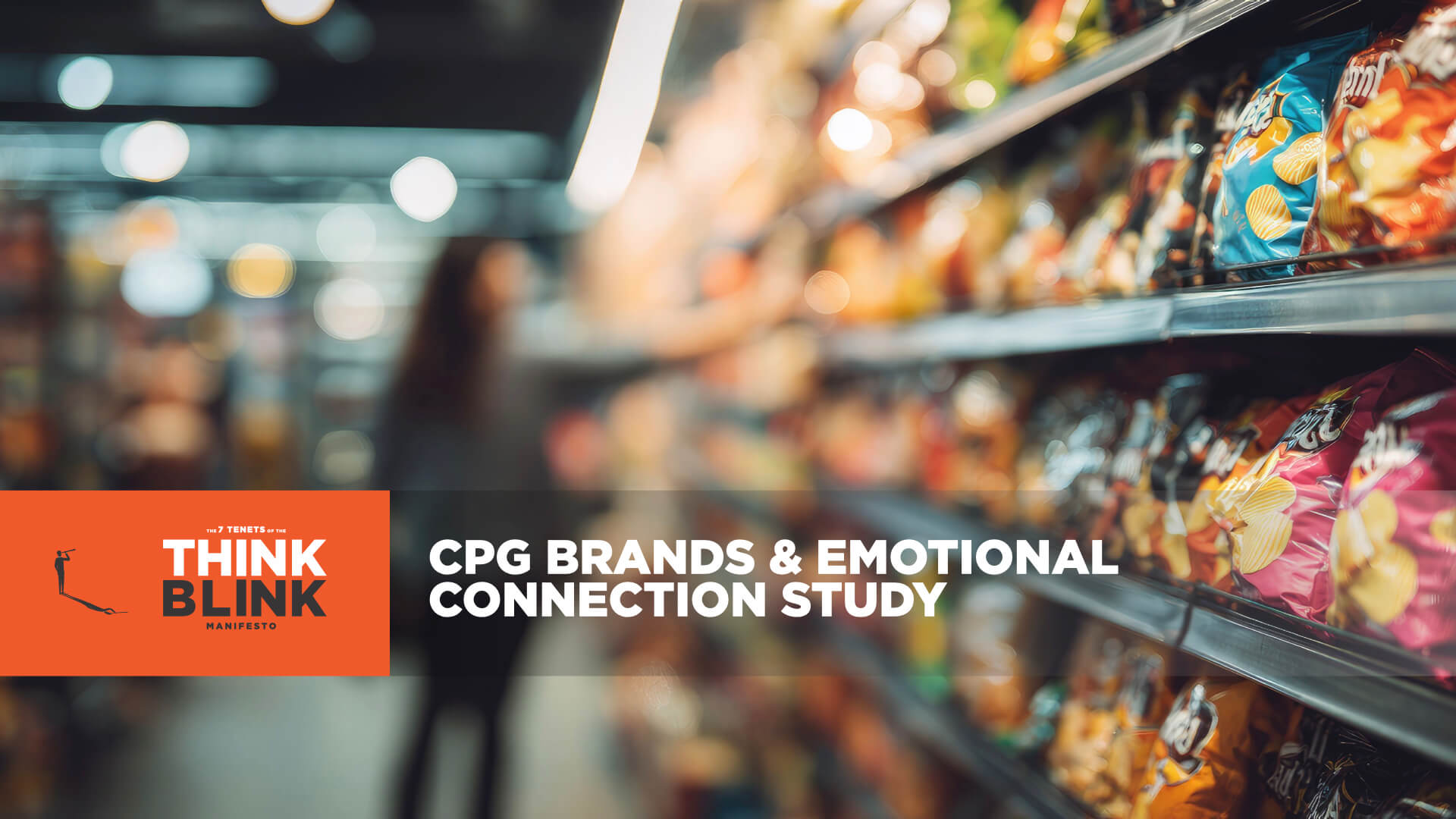 A blurry photo of a supermarket aisle filled with snacks, with a sign advertising "Think CPG & Emotional Needs" and a…