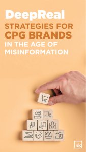 A hand holding a block with the word