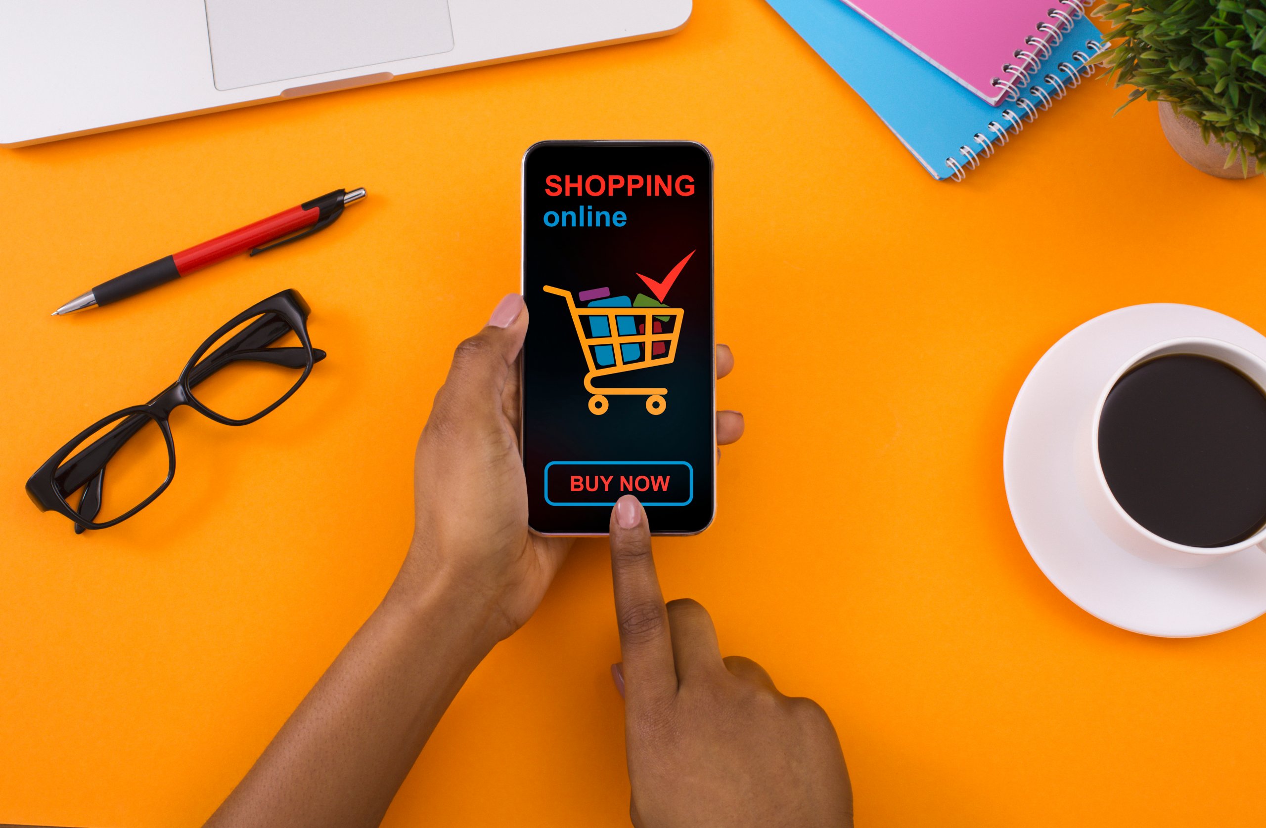 A person holding a smartphone displaying an online shopping advertisement