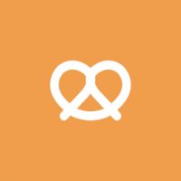 An orange background with a white heart-shaped logo in the center, which appears to be a stylized representation of a pretzel.