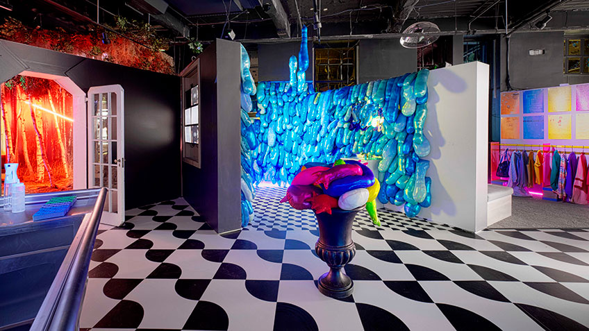 A vibrant store interior with colorful walls, a checkered floor, and various items on display.