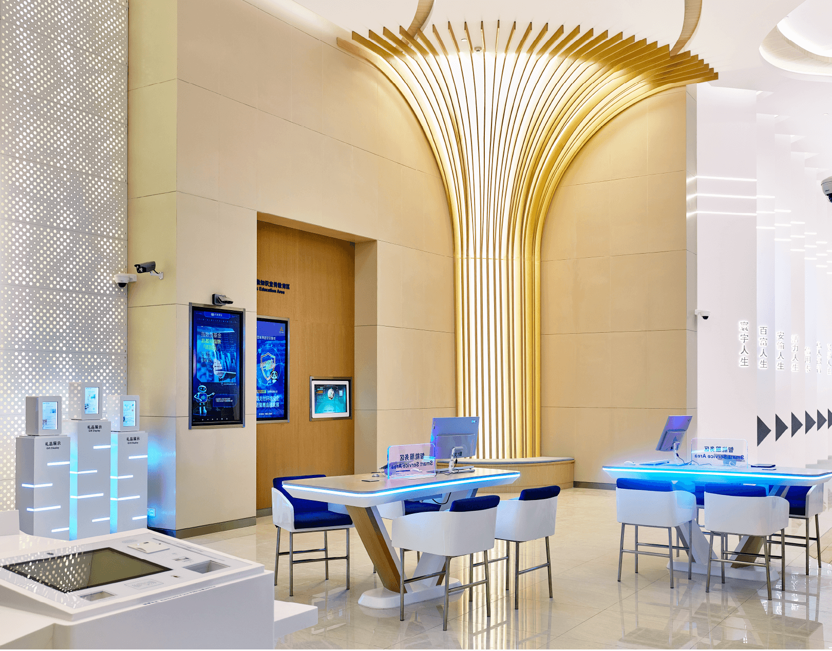 A modern, well-lit lobby with seating areas, a large screen displaying information, and a contemporary design.