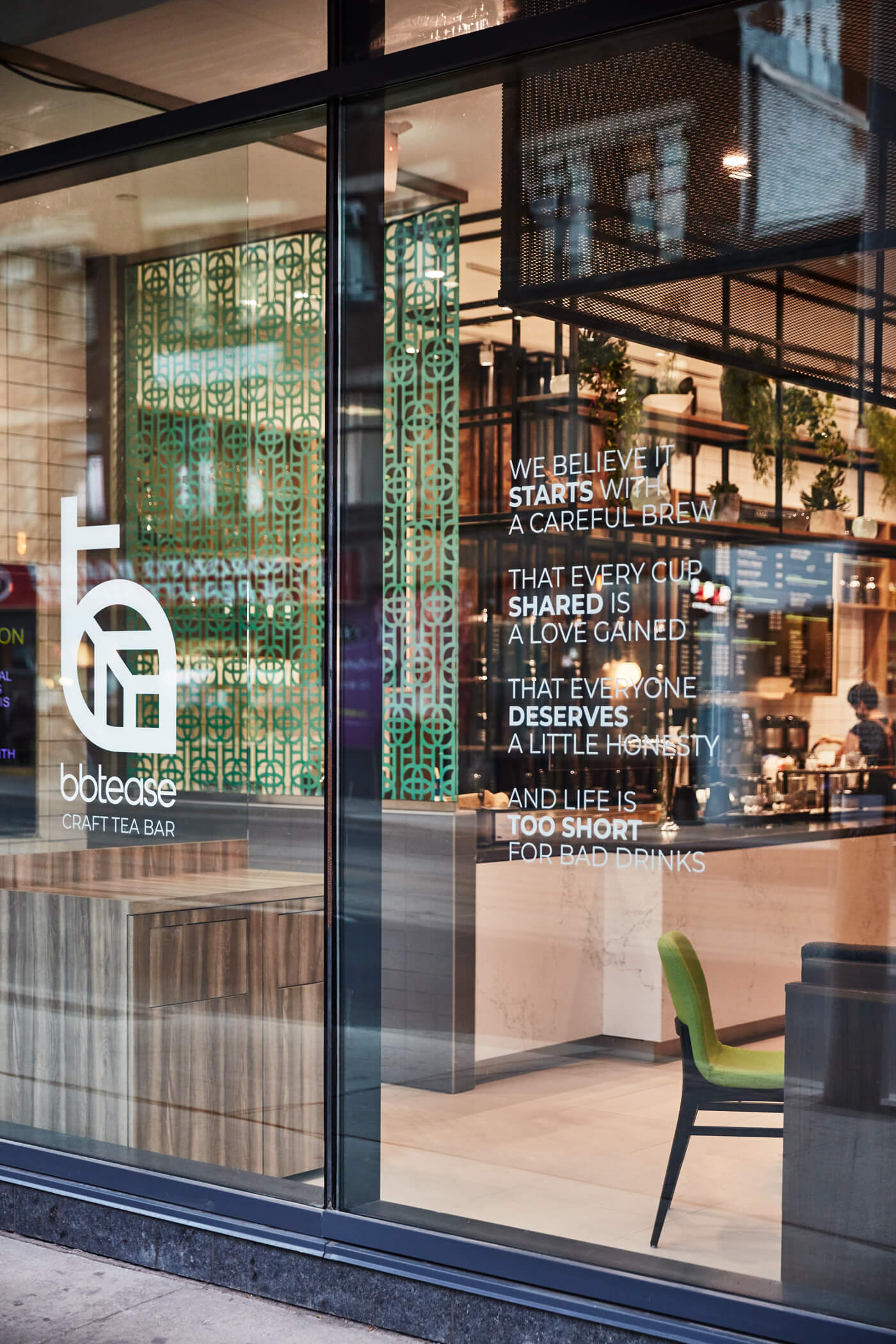 A storefront window displaying a restaurant interior.