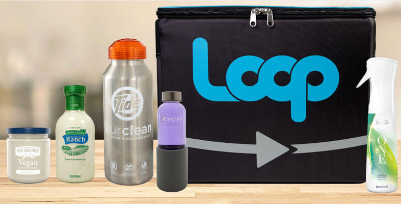 A black bag with a loop logo on it, containing various cleaning supplies, sitting on a table.