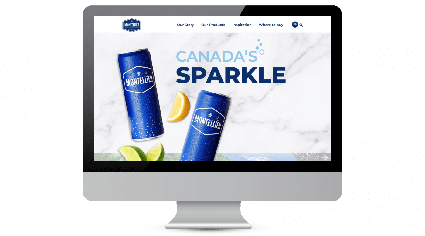 A computer screen displaying an advertisement for sparkling water with a backdrop of a marble table, two cans of sparkling water, and a lime.