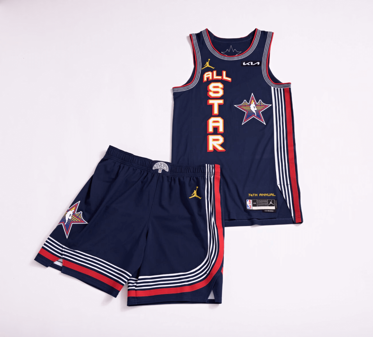 A sports jersey and shorts set laid out on a white background, featuring the logo of a basketball team and the name
