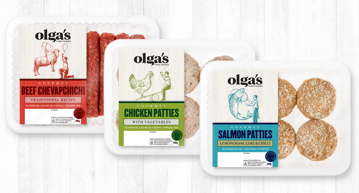 A collection of six different packaged food items displayed on a white surface, each labeled with the name of the product and ingredients.