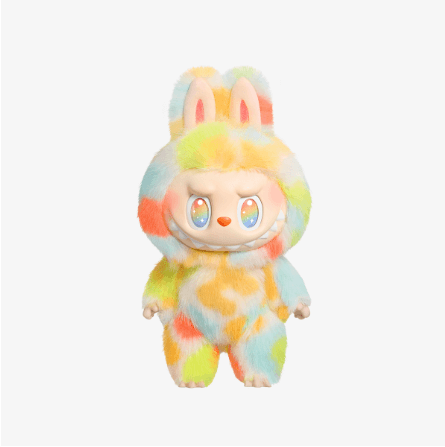 An image of a colorful, cartoonish stuffed animal resembling a rabbit with vibrant fur in shades of blue, green, yellow, and pink.