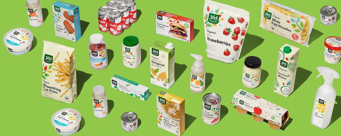 A collection of various food items displayed on a green surface.