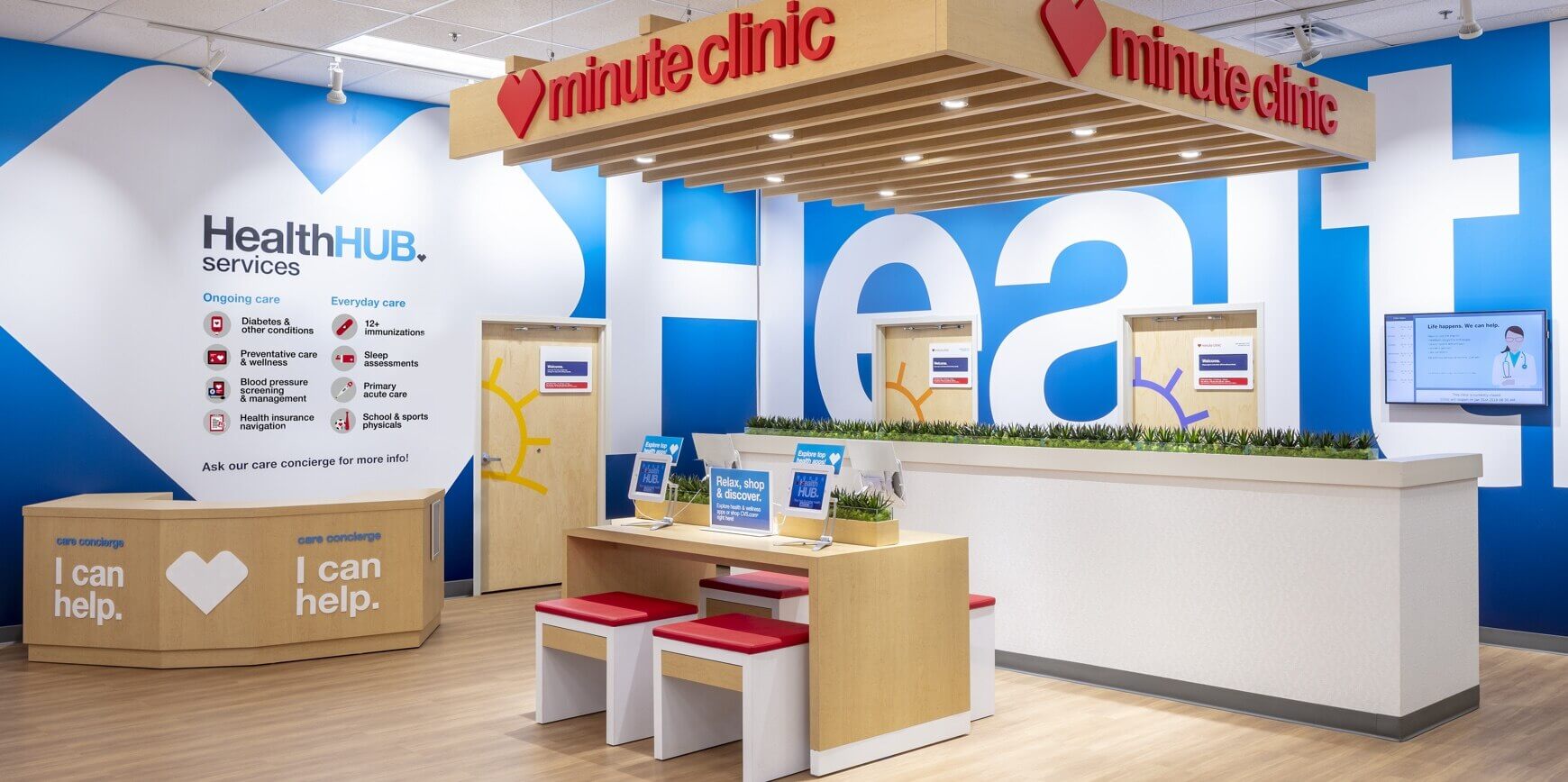 A brightly lit health clinic lobby with a blue and white color scheme, featuring a sign that reads