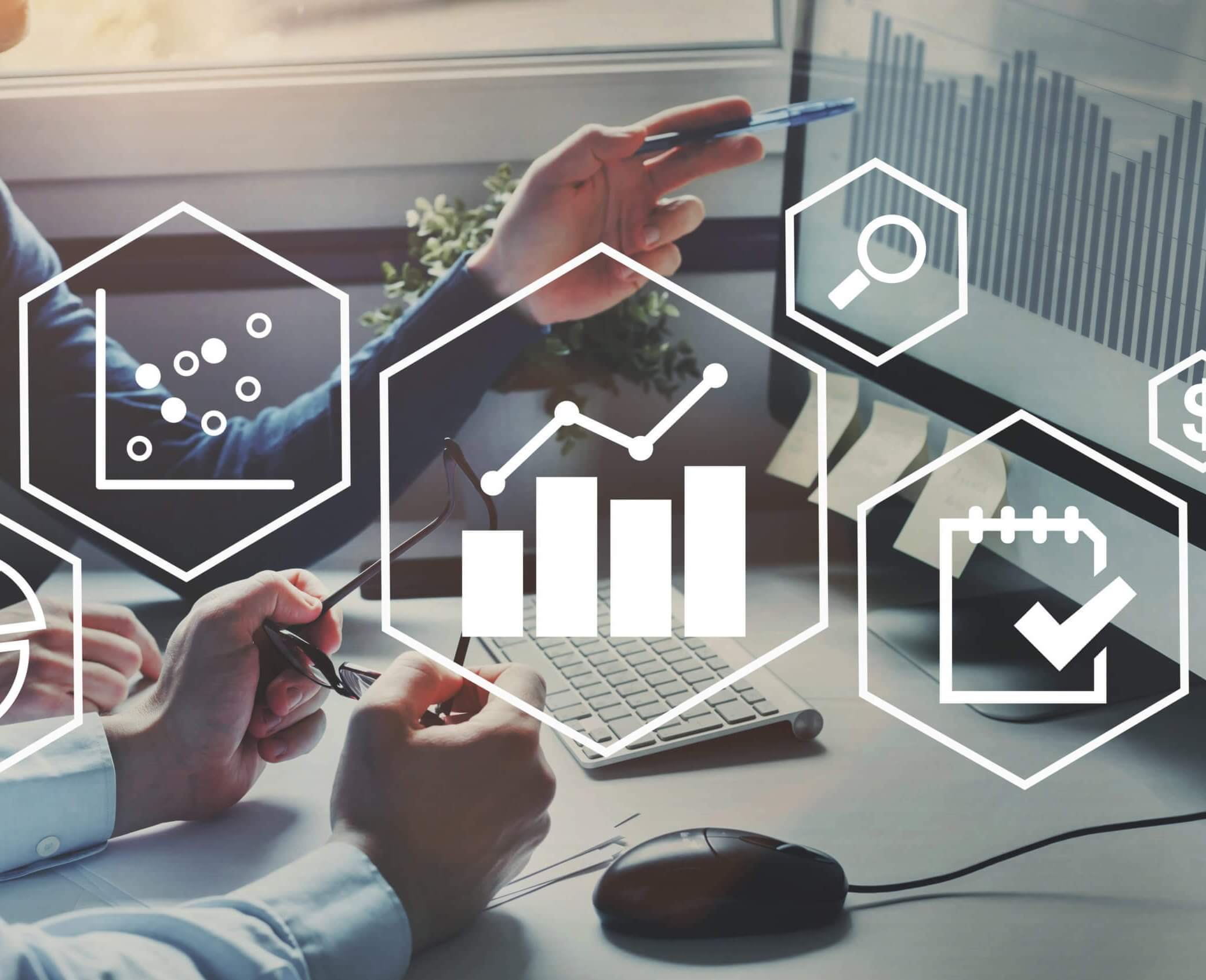 A digital graphic with an overlay of various business-related icons, including graphs, charts, and financial symbols, superimposed on a photograph…